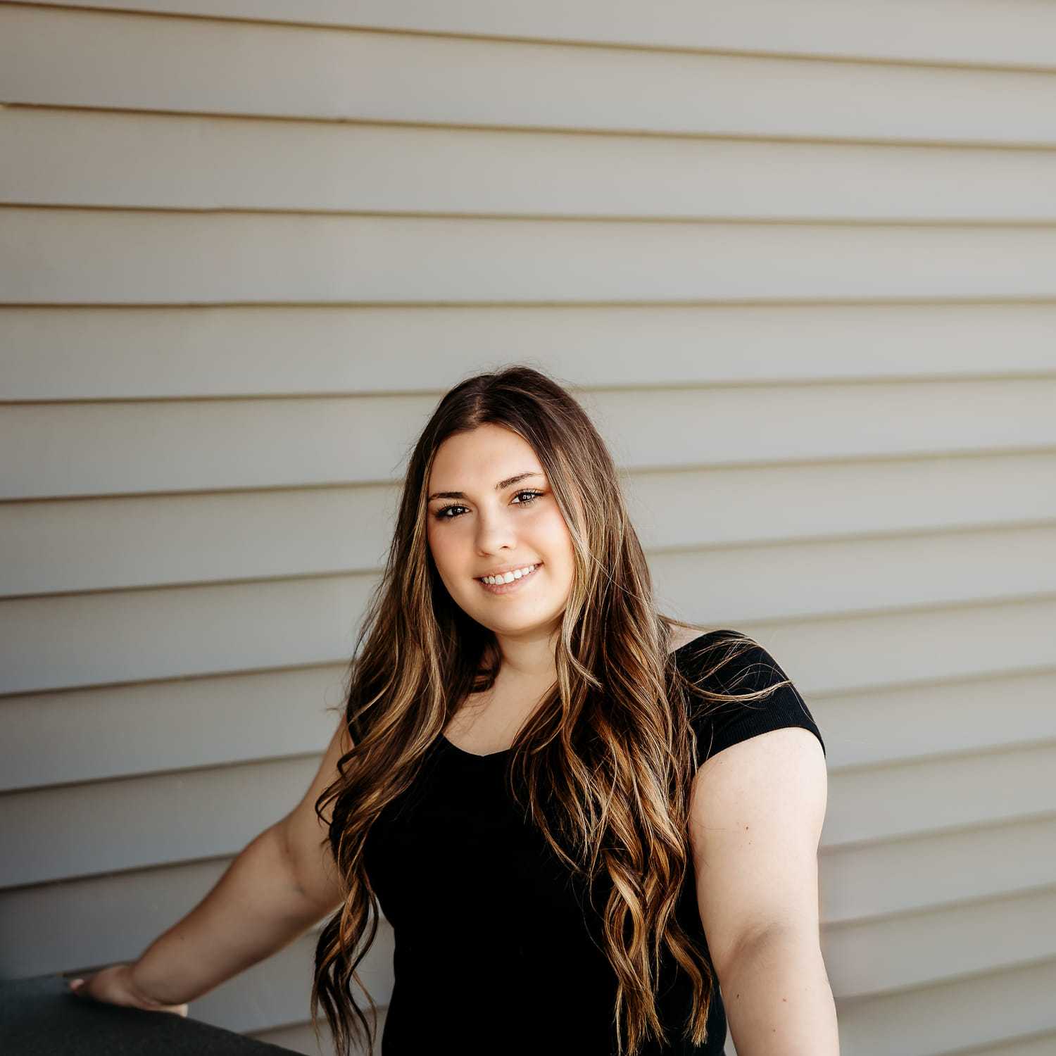 Portrait of Haley C., a professional stylist at Revive Salon & Spa, showcasing their expertise and style.