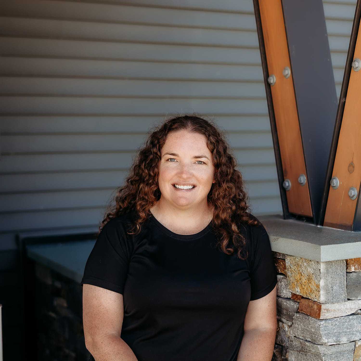 Portrait of Amanda J., a professional stylist at Revive Salon & Spa, showcasing their expertise and style.