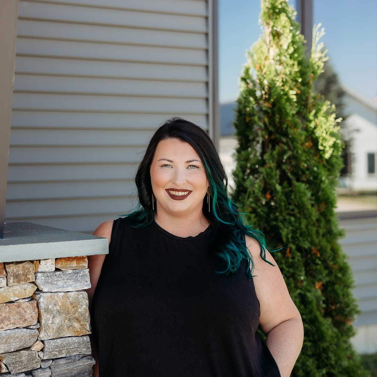 Portrait of Alyssa M., a professional stylist at Revive Salon & Spa, showcasing their expertise and style.