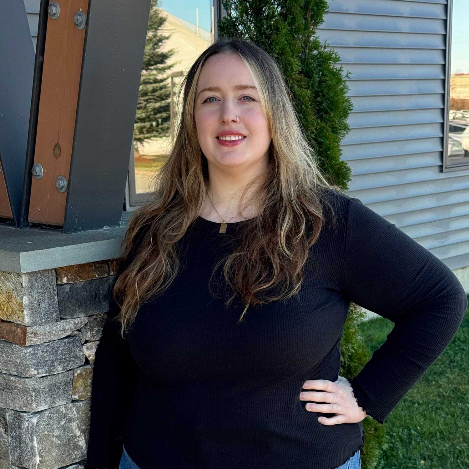 Portrait of Shyla F., a professional stylist at Revive Salon & Spa, showcasing their expertise and style.