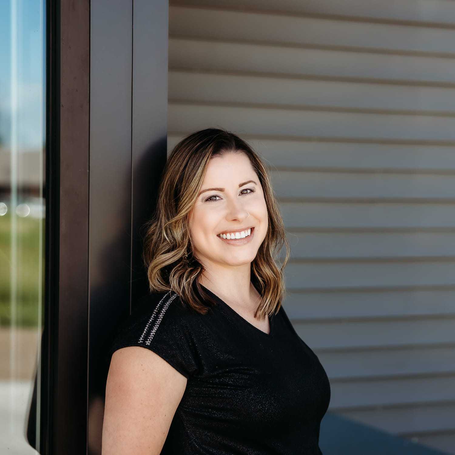 Portrait of Danielle M., a professional stylist at Revive Salon & Spa, showcasing their expertise and style.