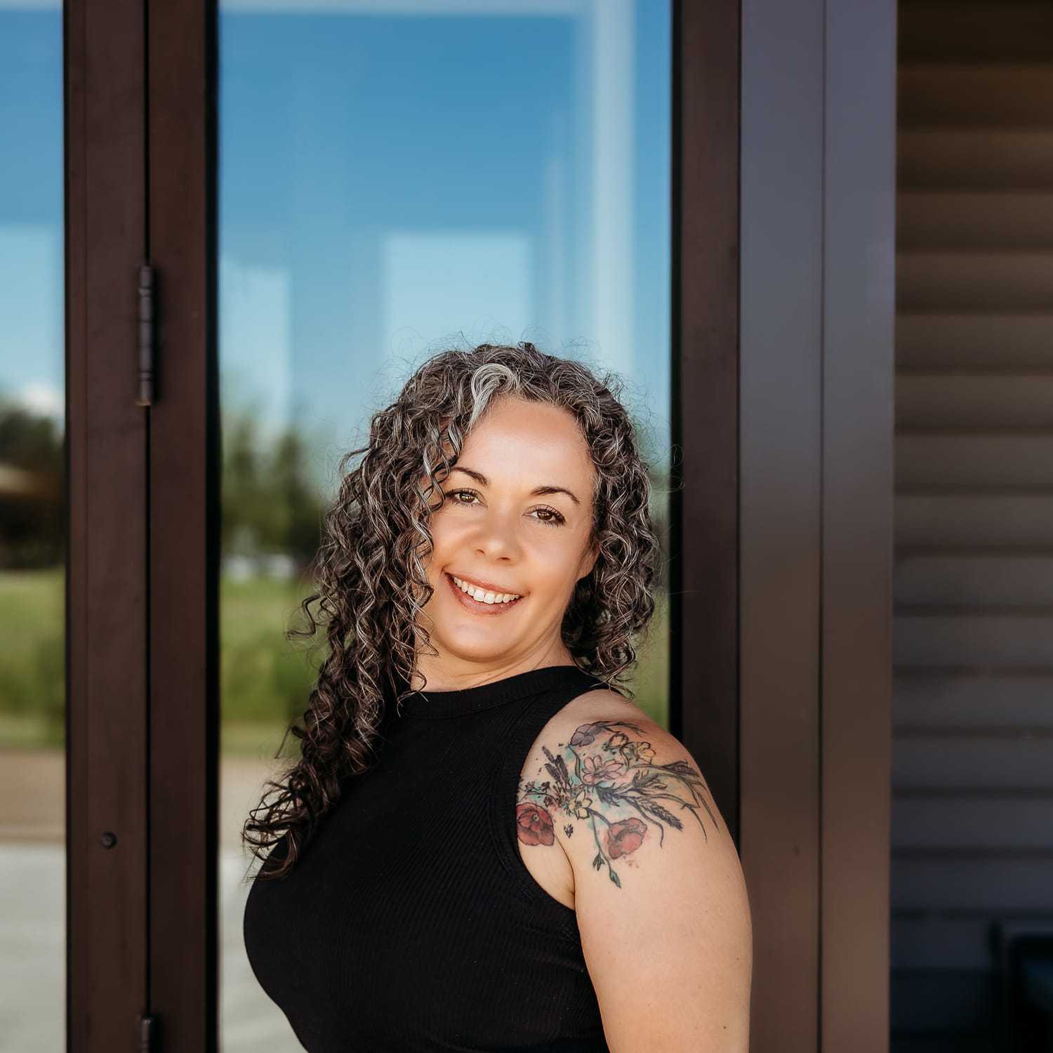 Portrait of Angela B., a professional stylist at Revive Salon & Spa, showcasing their expertise and style.