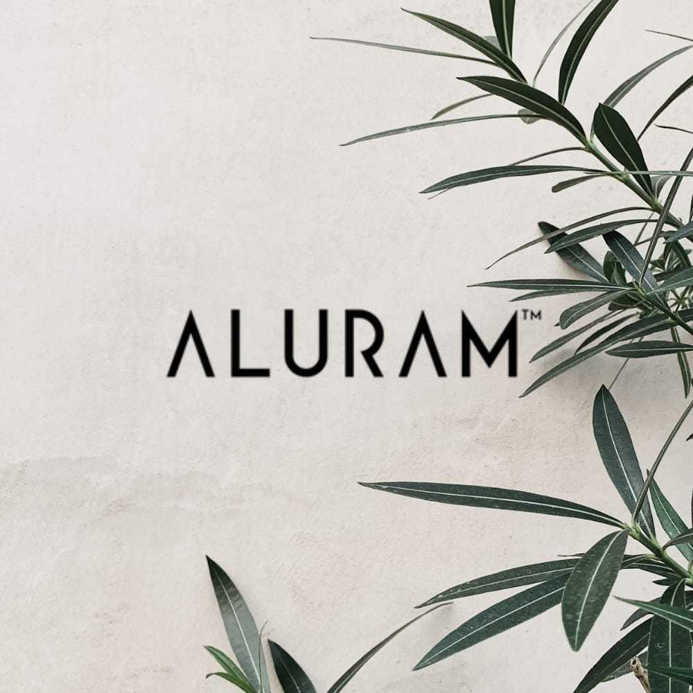 Aluram logo on a white background with green leaves.